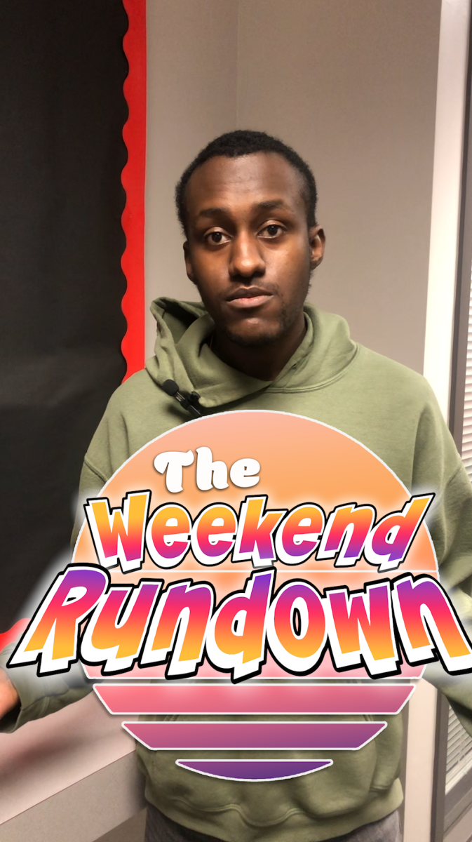 Jonathan Shelby stands behind the Weekend Rundown logo. In this Weekend Writeup, you can find events such as a medieval event, a new convention and the soft opening of a new store in Sycamore. (Jenny Javkhlantugs | Northern Star)